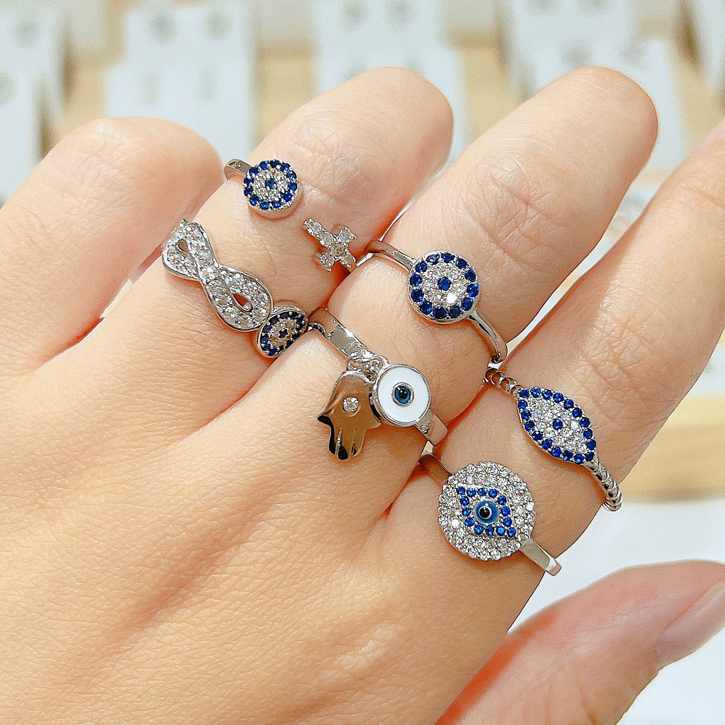 Sapphire and white zircon round shape evil eye silver 925 ring
