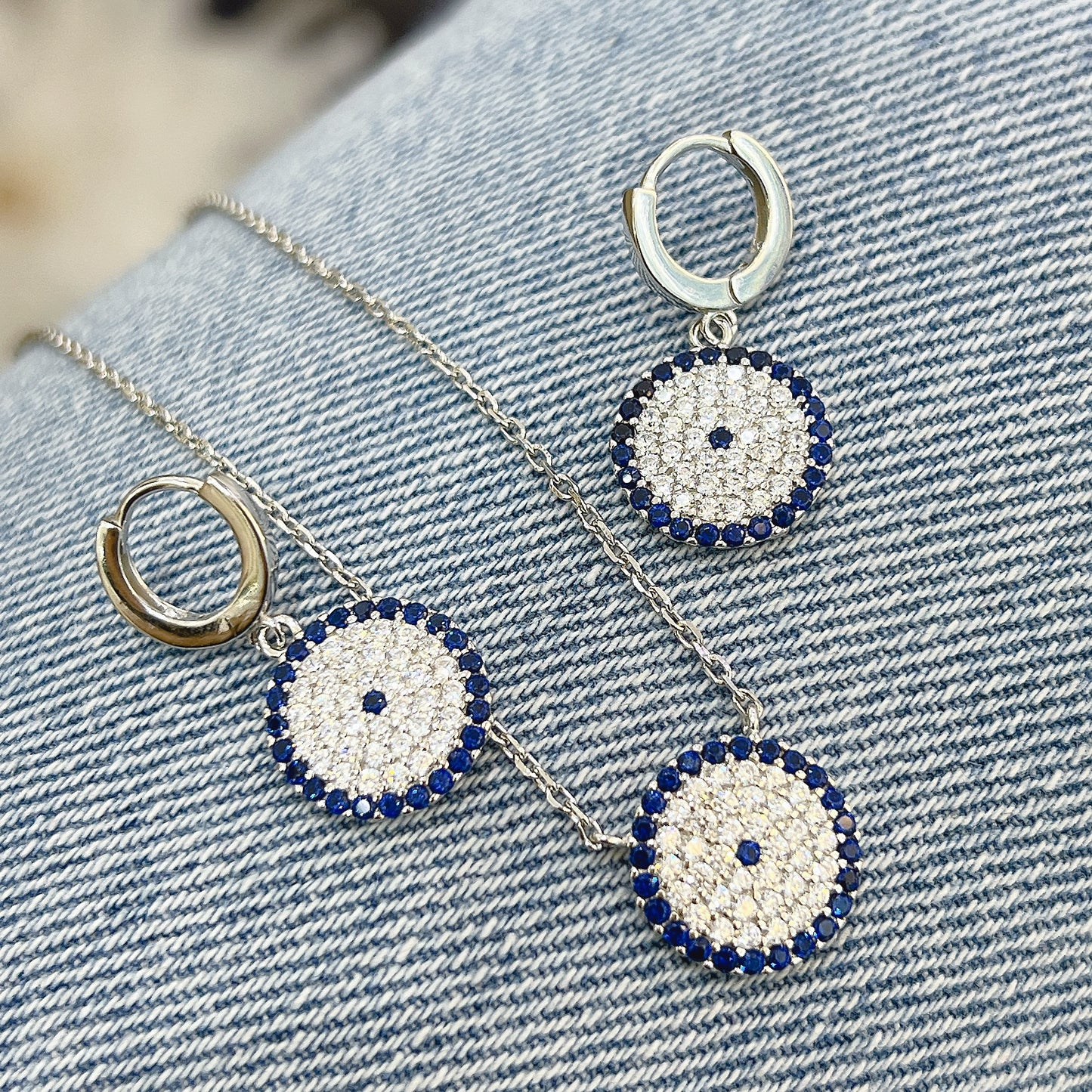 Sapphire and white zircon round shape evil eye silver 925 huggie earrings