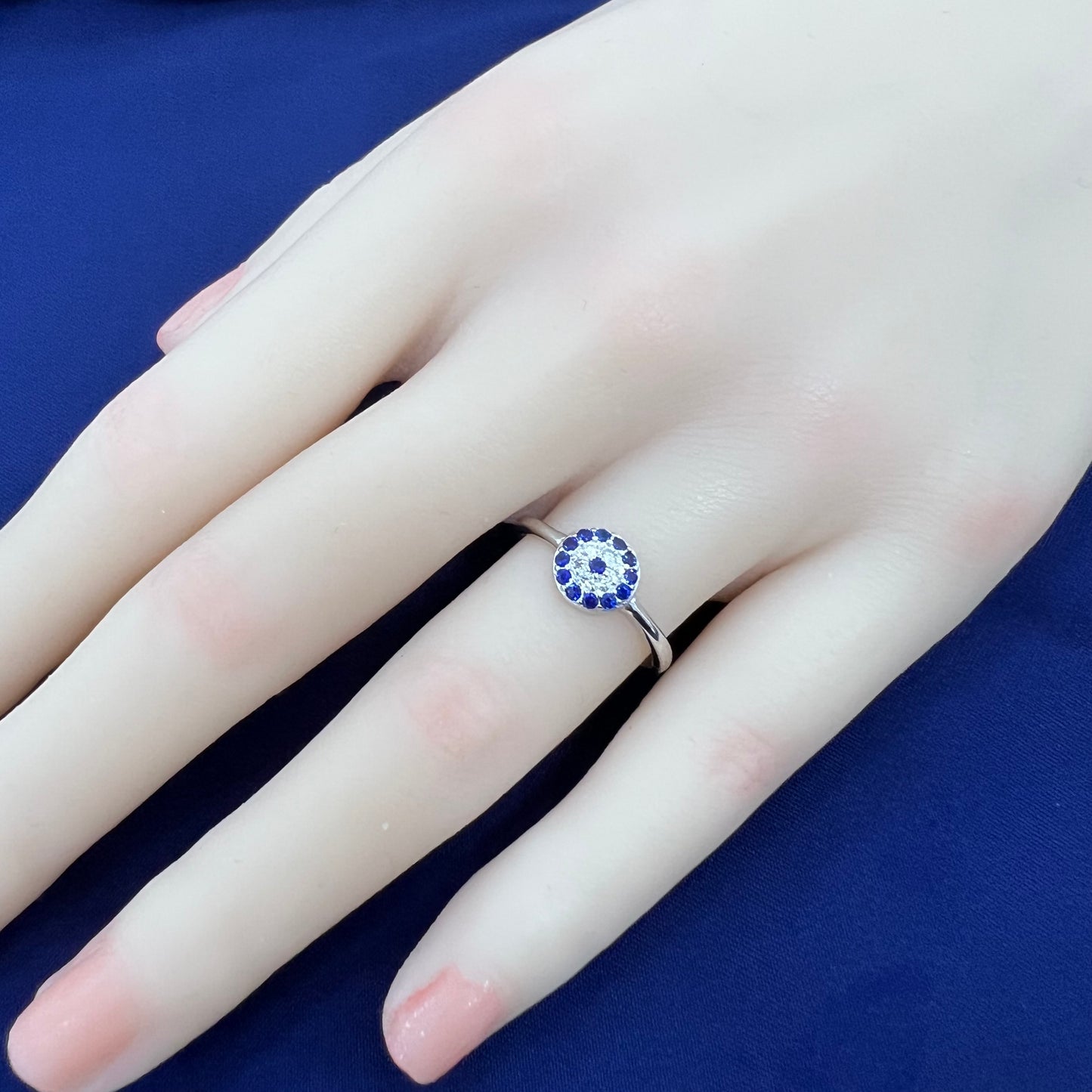 Sapphire and white zircon round shape evil eye silver 925 ring