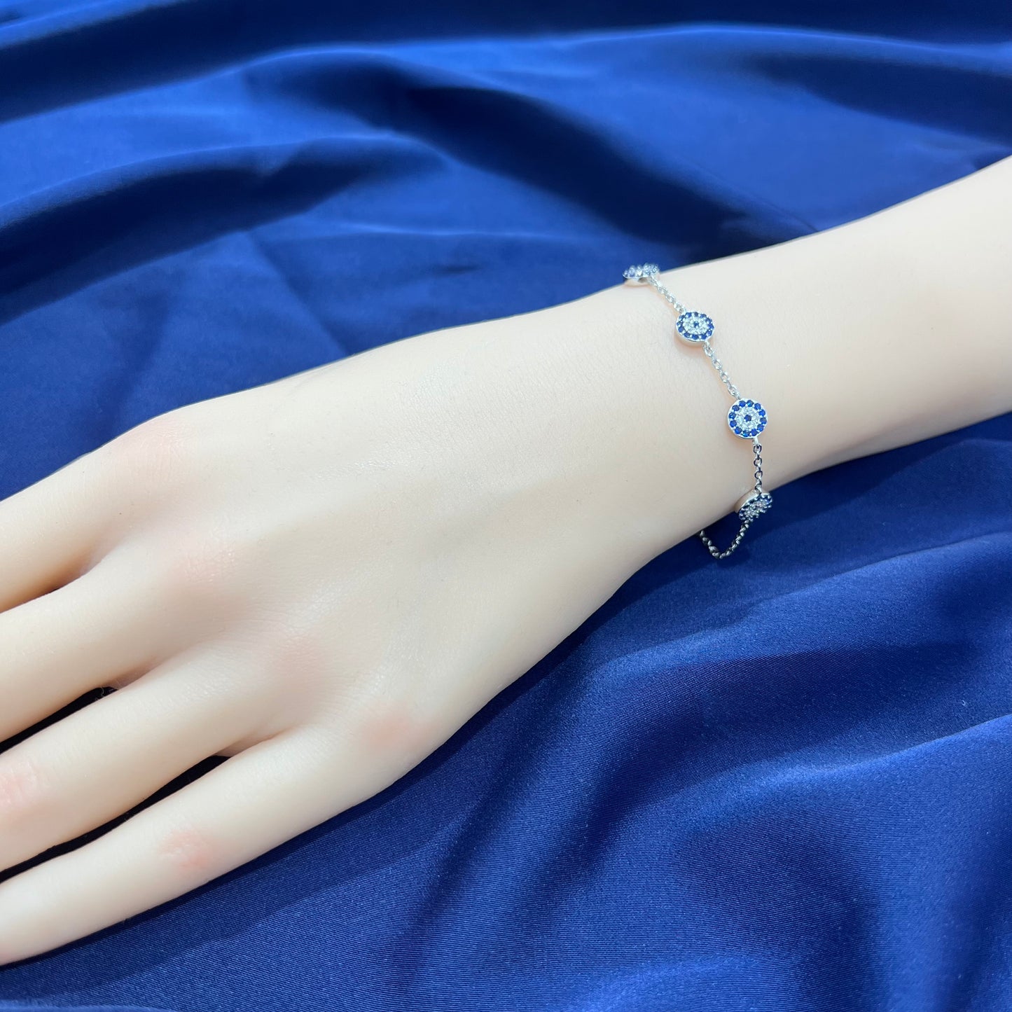 Sapphire and white zircon 7mm round shape 4 evil eyes silver 925 bracelet